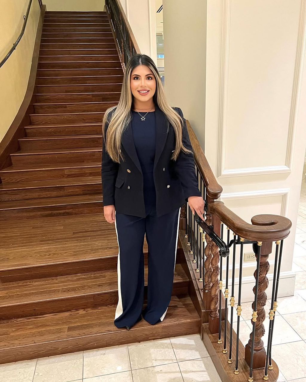 Misa Caba standing on the staircase